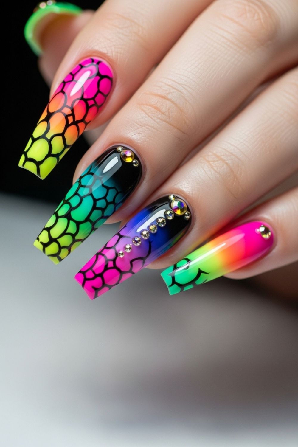 “Close-up of a straight flat hand with nude nails featuring minimal white lines and delicate gold accents, bright clean background softly blurred.”